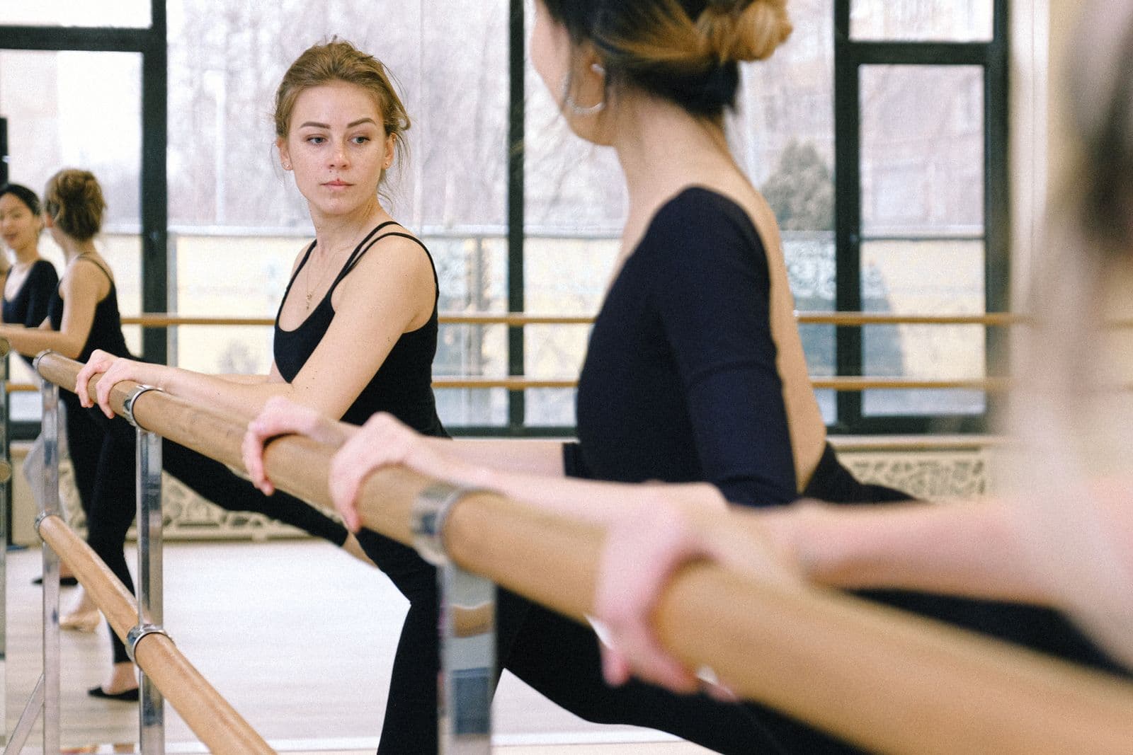 Barre class at the ballet barre in the AMP Fitness studio in Mesa, AZ.