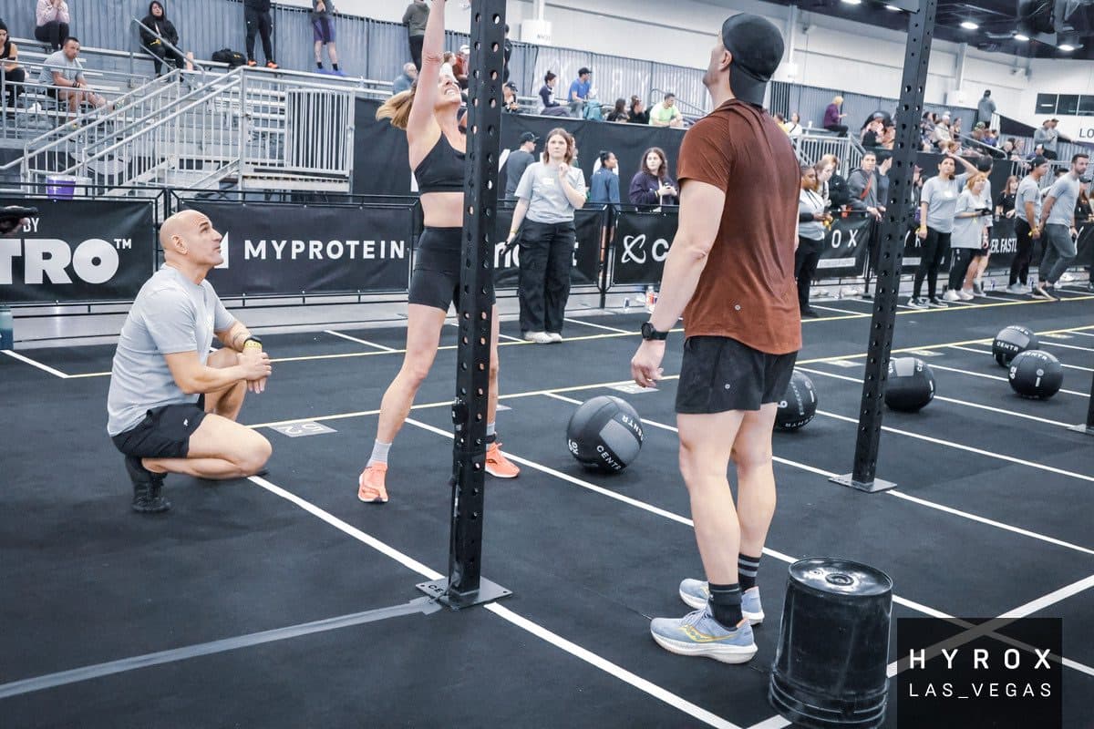 AMP Fitness athletes competing at a HYROX fitness race.