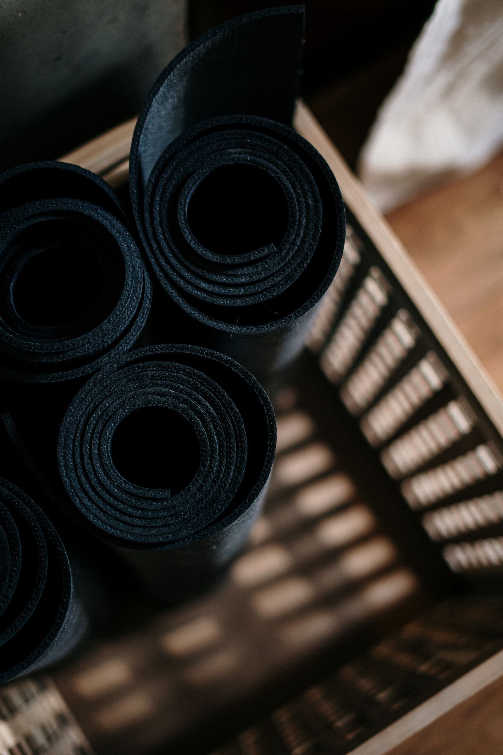 Rolled class mats ready for an AMP Fitness group session in the Mesa, AZ studio.