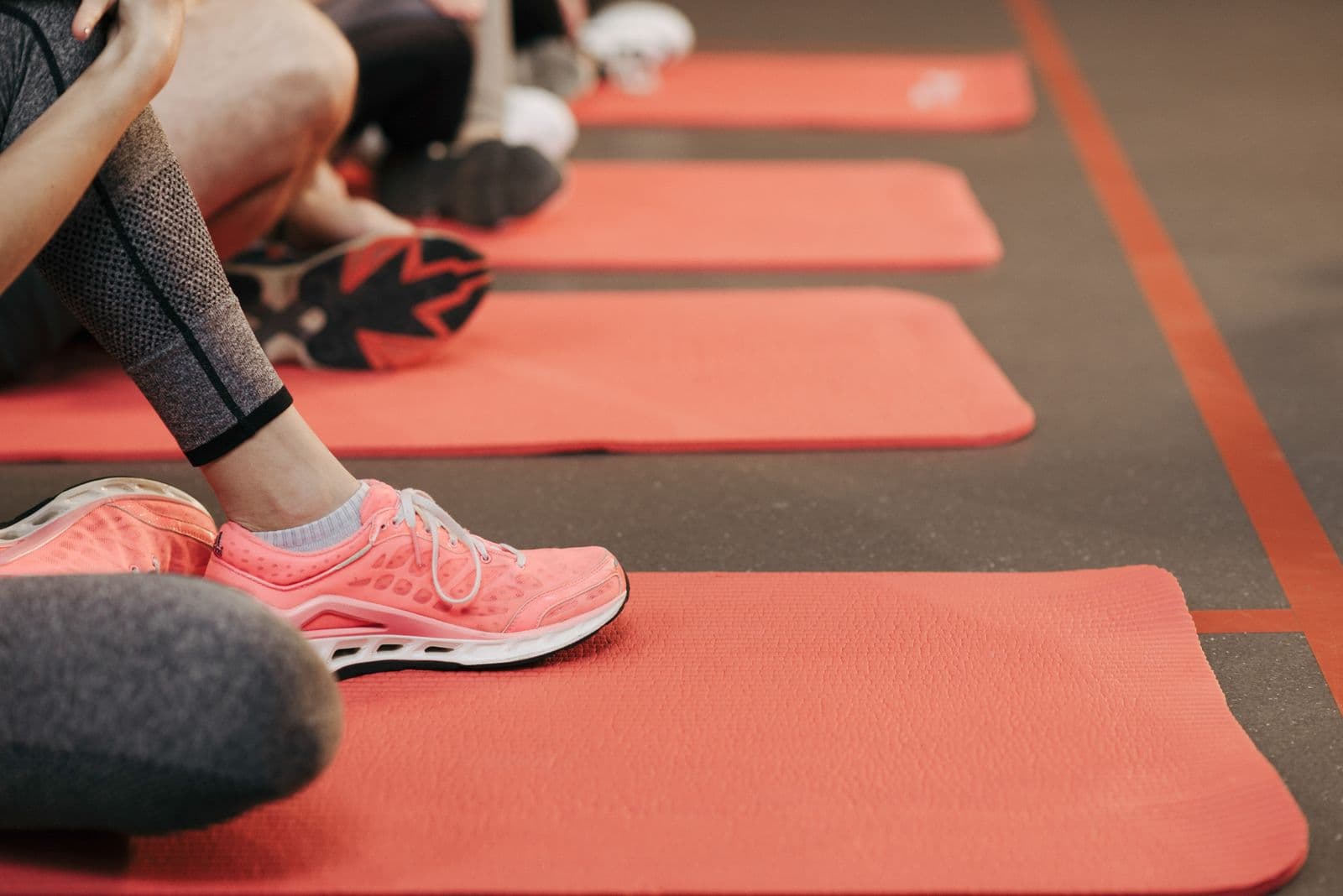 AMP Fitness group fitness class with training mats laid out in the Mesa, AZ studio.