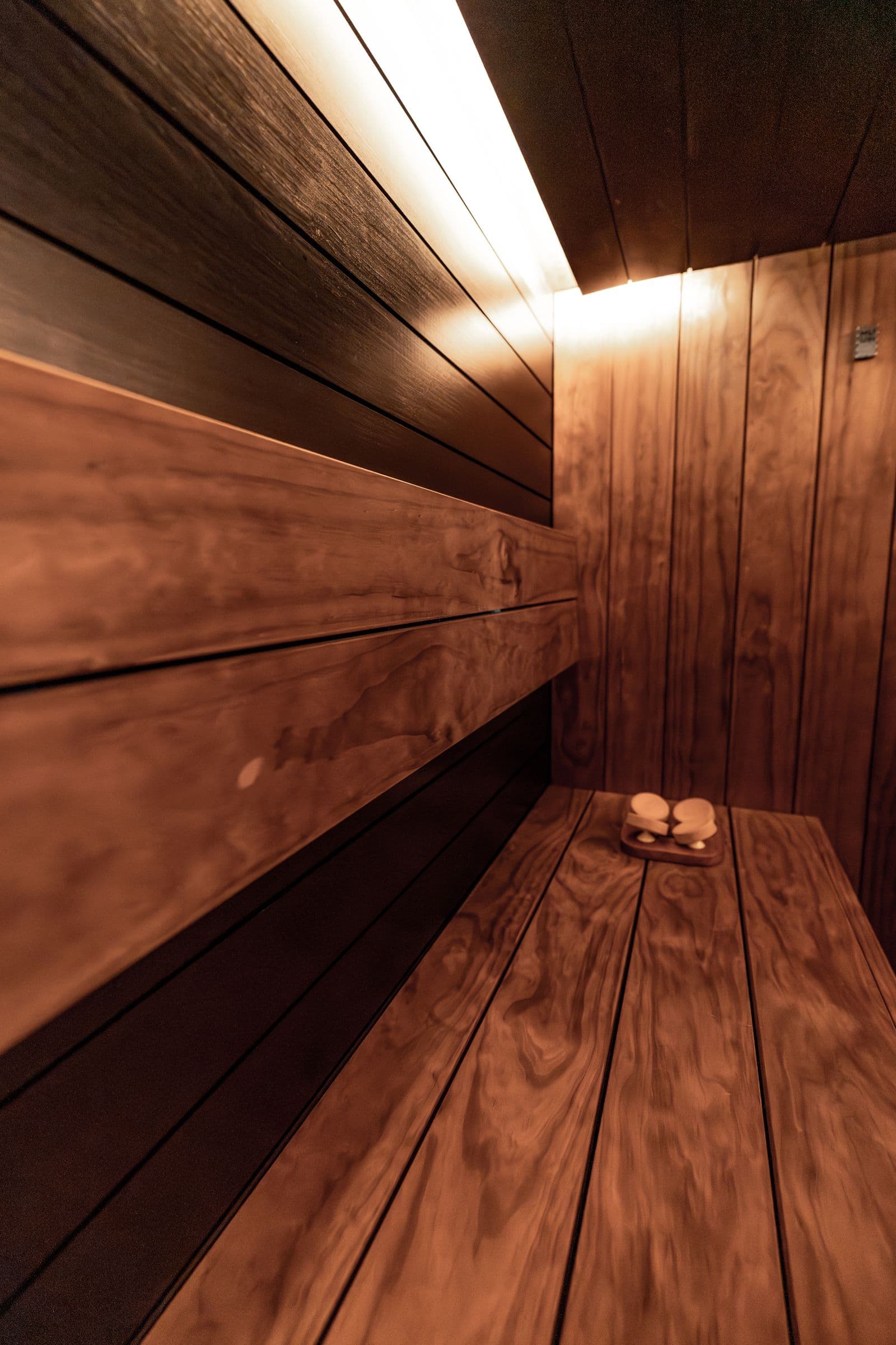 Warm wood sauna in the premium recovery and wellness suite at AMP Fitness in Mesa, AZ.