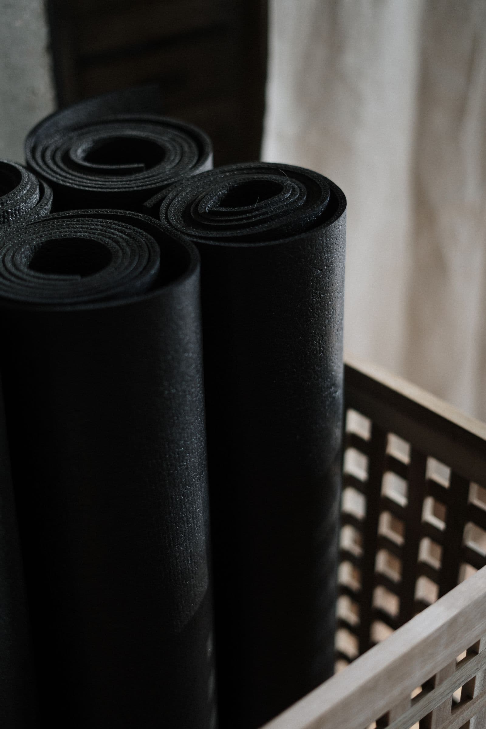 Rolled wellness mats in a calm studio representing pre and post natal therapy at AMP Fitness in Mesa, AZ.